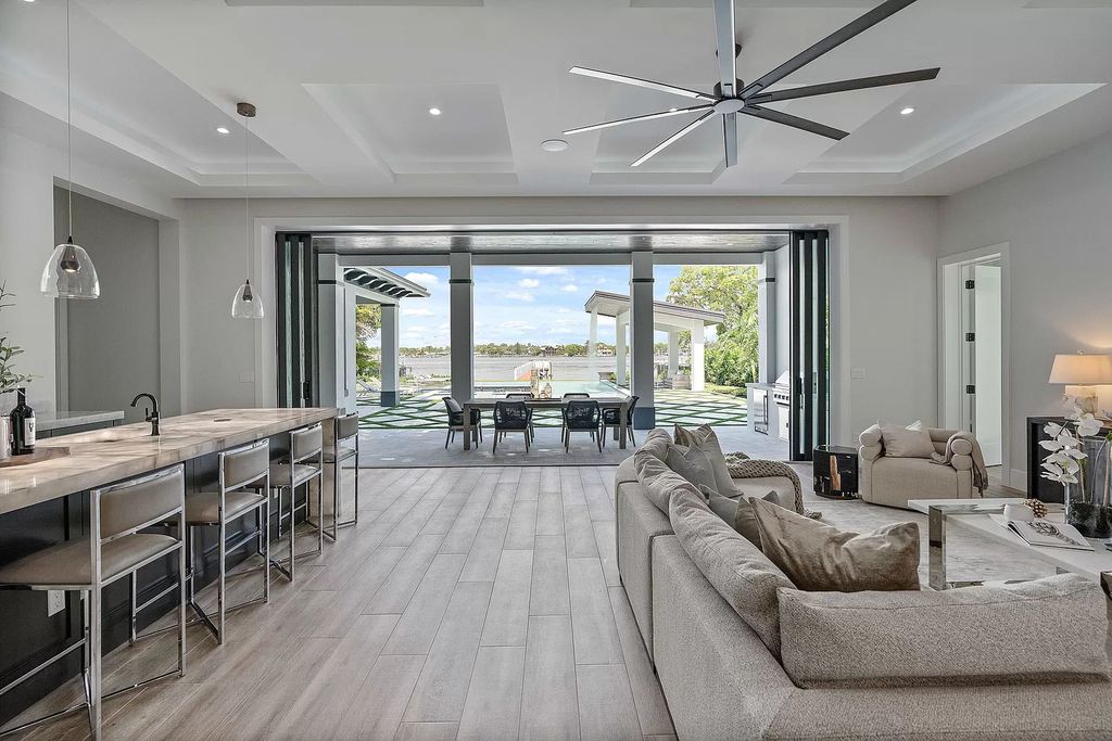 The Home in Lake Worth is a brand new construction on Hypoluxo Island with stunning modern contemporary design and insane wide Intracoastal views now available for sale. This home located at 701 S Atlantic Dr, Lake Worth, Florida