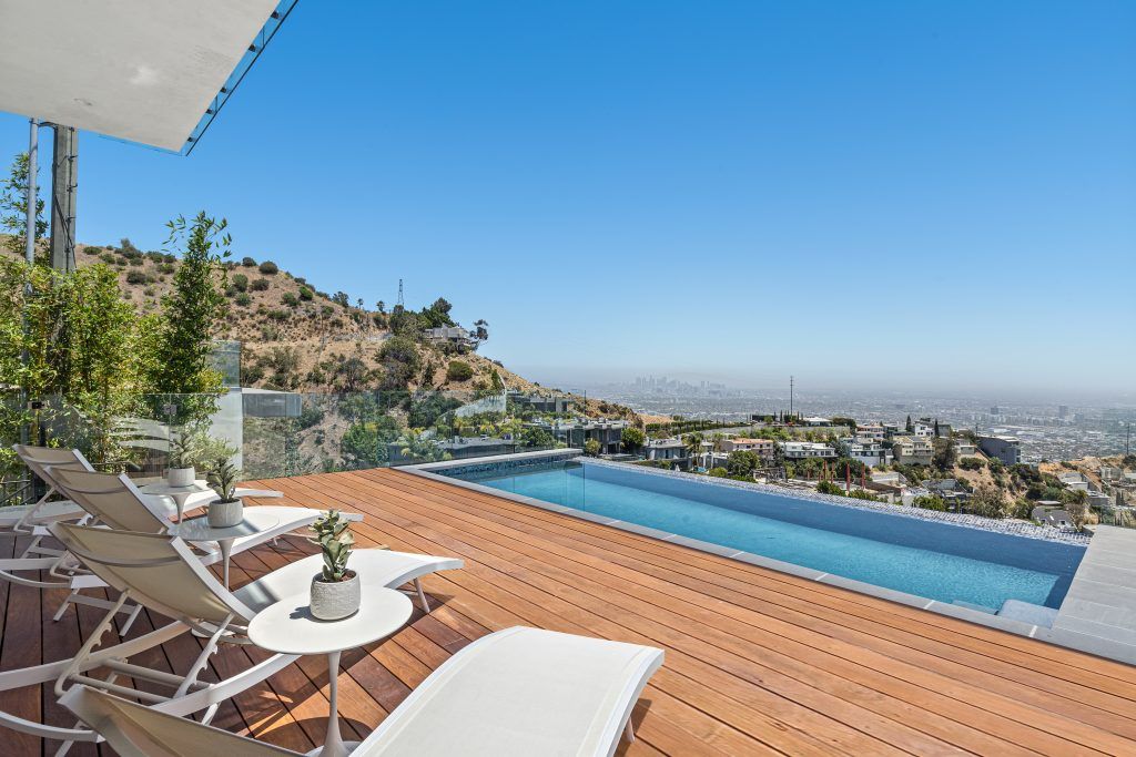 The Home in Los Angeles is a spectacular residence on a private drive off Sunset Plaza with breathtaking panoramic downtown views now available for sale. This home located at 1916 Sunset Plaza Dr, Los Angeles, California