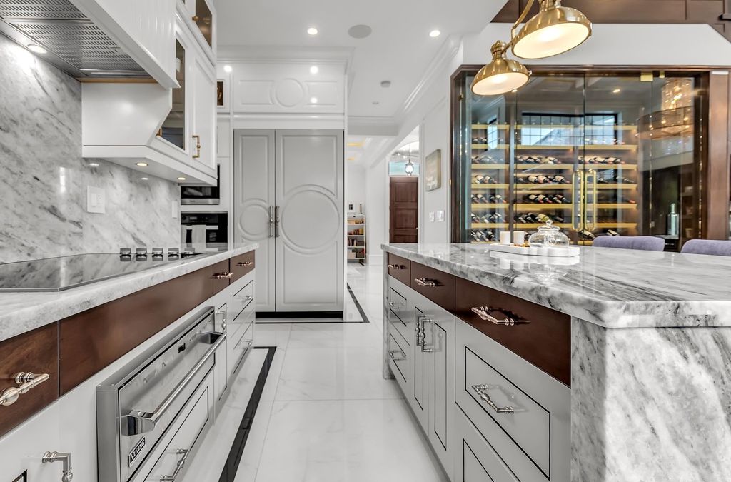 The Home in Richmond is an absolutely stunnig custom built home with dream gourmet kitchen, an amazing glass wine cellar and bar, now available for sale. This home located at 7168 Gilhurst Cres, Richmond, BC V7A 1N9, Canada