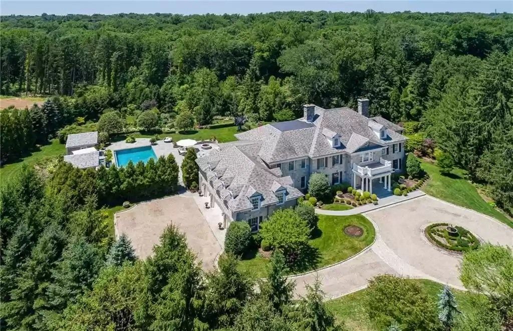 The Residence in Connecticut offers indoor and outdoor spaces that flow together, inviting informal and formal gathering, now available for sale. This home located at 36 Andrews Farm Rd, Greenwich, Connecticut