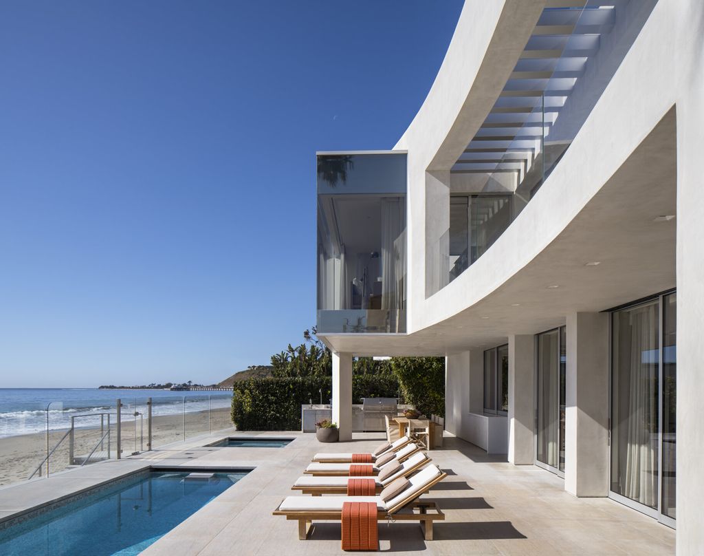 The Home in Malibu is a remarkable beachfront estate with impeccable architectural credentials and one of Southern California's most enviable settings now available for sale. This home located at 22446 Pacific Coast Hwy, Malibu, California