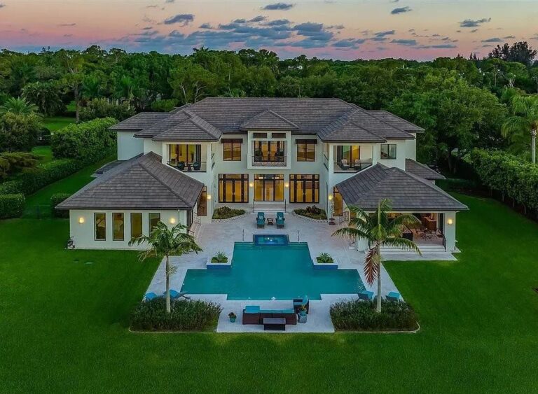 This $10,250,000 Magnificent Home in Naples features Dramatic Architecture on The Premium 1 Acre Lakefront Lot