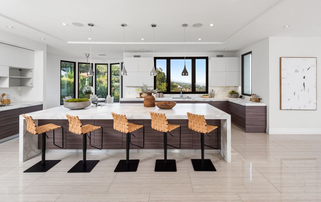The Home in Beverly Hills is one of a kind gated contemporary residence  with over 7,000 square foot of open spaces and an overabundance of indoor outdoor entertainment living now available for sale. This home located at 1280 Angelo Dr, Beverly Hills, California