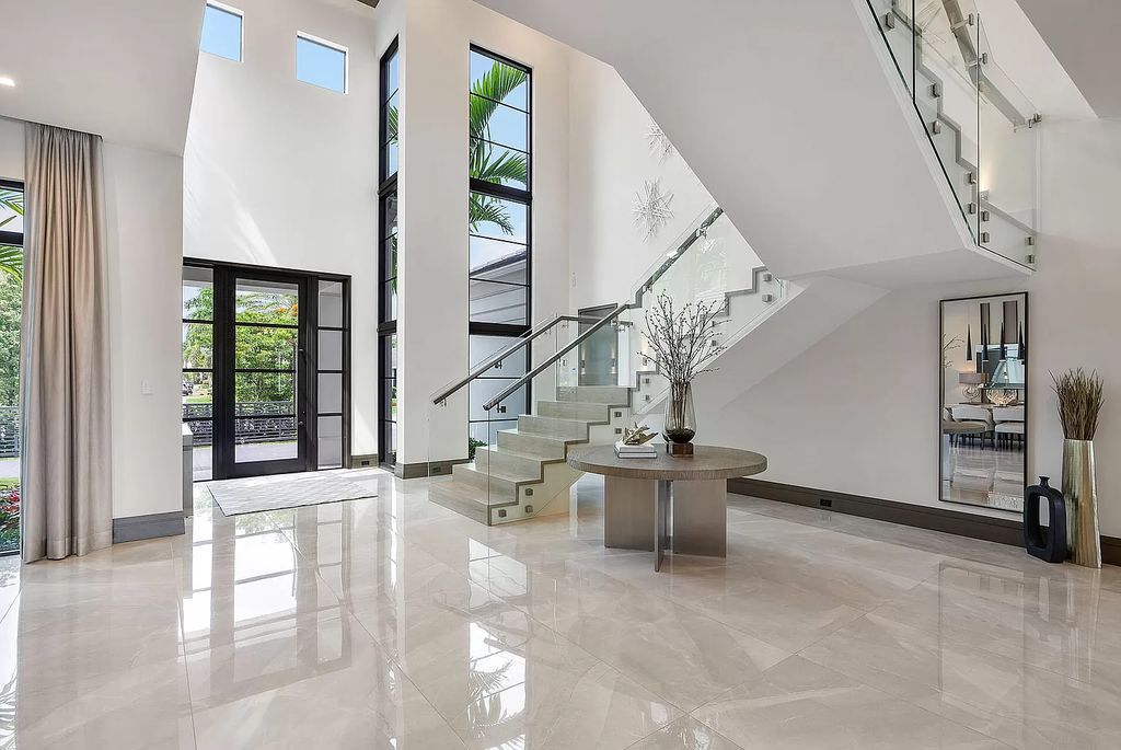 The Home in Boca Raton is a turnkey 2020 SRD Building Corp home offers a slice of paradise with 102′ of golf course frontage now available for sale. This home located at 170 Royal Palm Way, Boca Raton, Florida