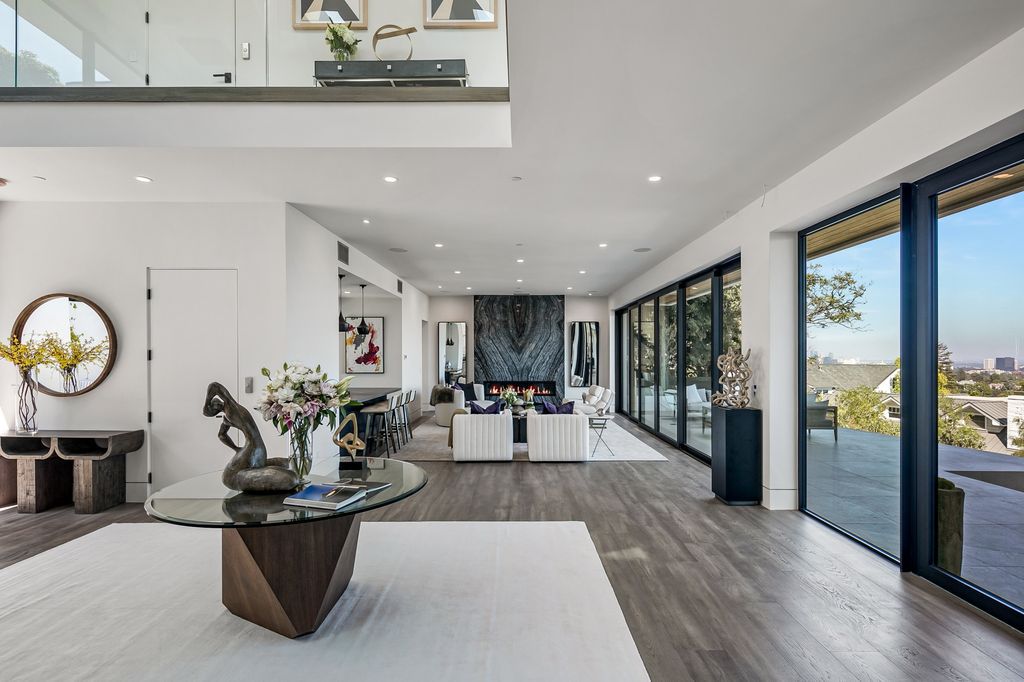 The Home in Pacific Palisades is a new contemporary home personifies abstract reductionist minimalism perched above the trees in the highly coveted Riviera now available for sale. This home located at 1635 Casale Rd, Pacific Palisades, California