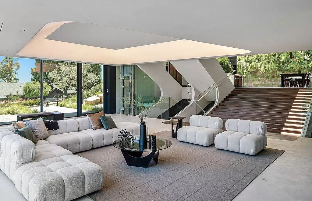The Home in Bel Air is an unique residence in the highly coveted hills of Bel Air has an automotive inspired intelligible shell and was CNC milled from digital design now available for sale. This home located at 1254 Roberto Ln, Los Angeles, California