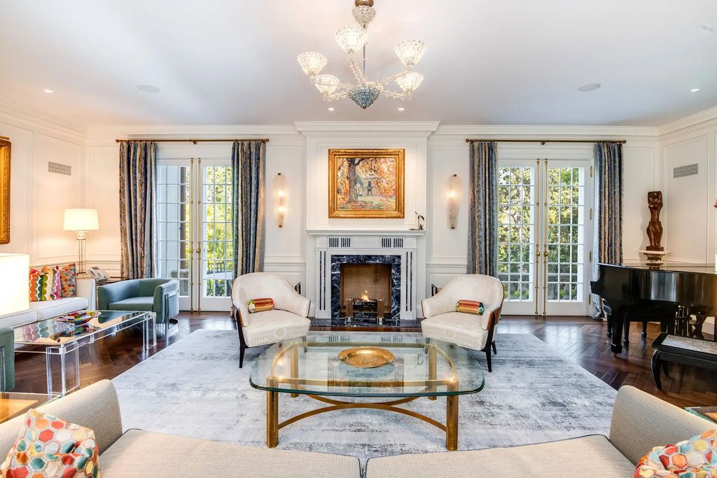 The Home in Los Angeles is a traditional estate in the heart of prime Little Holmby offers an enchanting setting with meticulously manicured grounds, captivating faade, and timeless authenticity now available for sale. This home located at 10301 Strathmore Dr, Los Angeles, California
