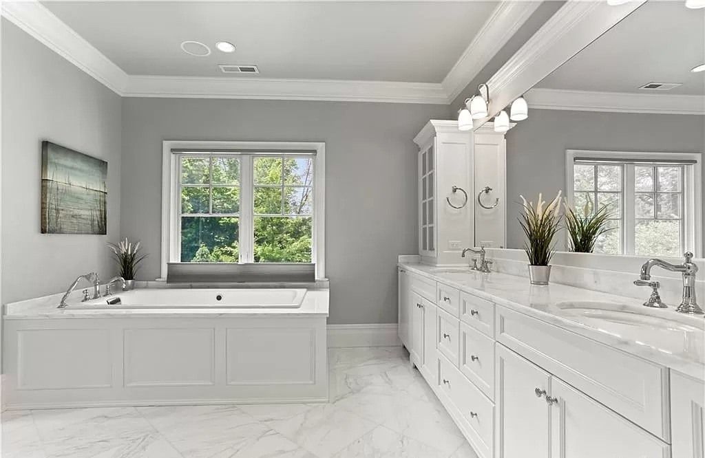 When it comes to gray bathroom ideas, painting the ceiling in a coordinating shade can be a great way to add interest and depth to the space. A light or medium gray ceiling can help balance out darker or bolder wall colors, creating a cohesive and calming atmosphere. Alternatively, a darker shade of gray on the ceiling can add drama and sophistication to a neutral or monochromatic bathroom. To enhance the effect, consider adding a decorative element, such as a statement light fixture or ceiling medallion, to draw the eye upward and make the ceiling a focal point of the room.