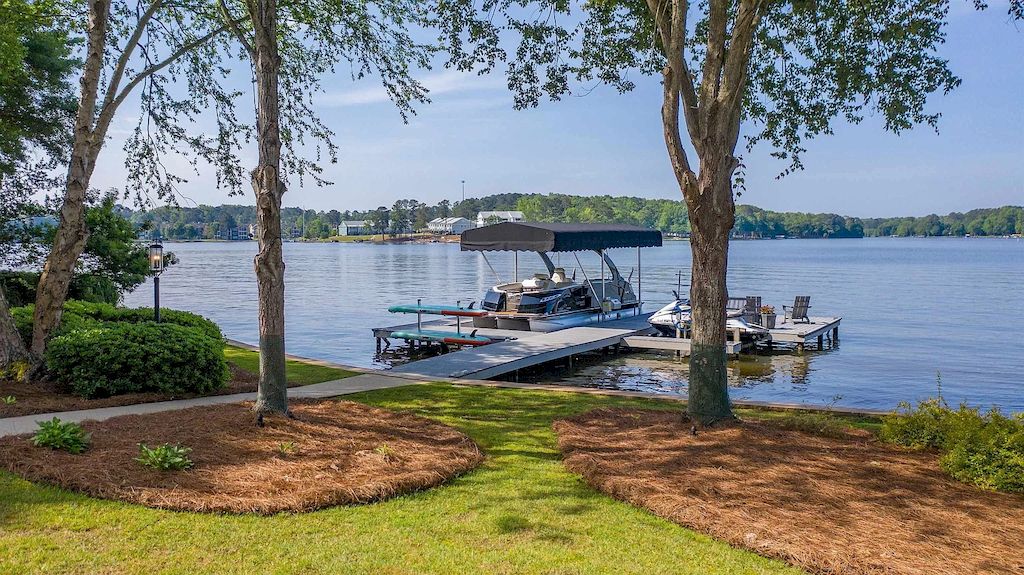 The Estate in Georgia is a luxurious home situated on a gorgeous premium private lot offering spectacular water views now available for sale. This home located at 150 Wildwood Dr, Eatonton, Georgia; offering 05 bedrooms and 06 bathrooms with 6,756 square feet of living spaces.