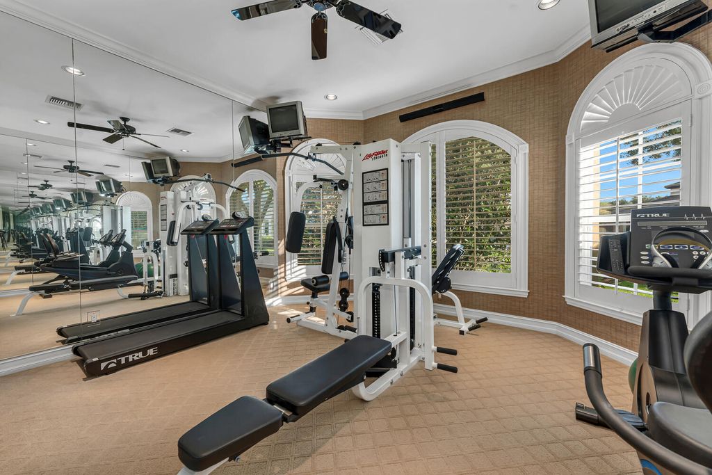 The Home in Naples is an exceptional custom home unlike any other in Watercrest with resort style outdoor area now available for sale. This home located at 2350 Cheshire Ln, Naples, Florida