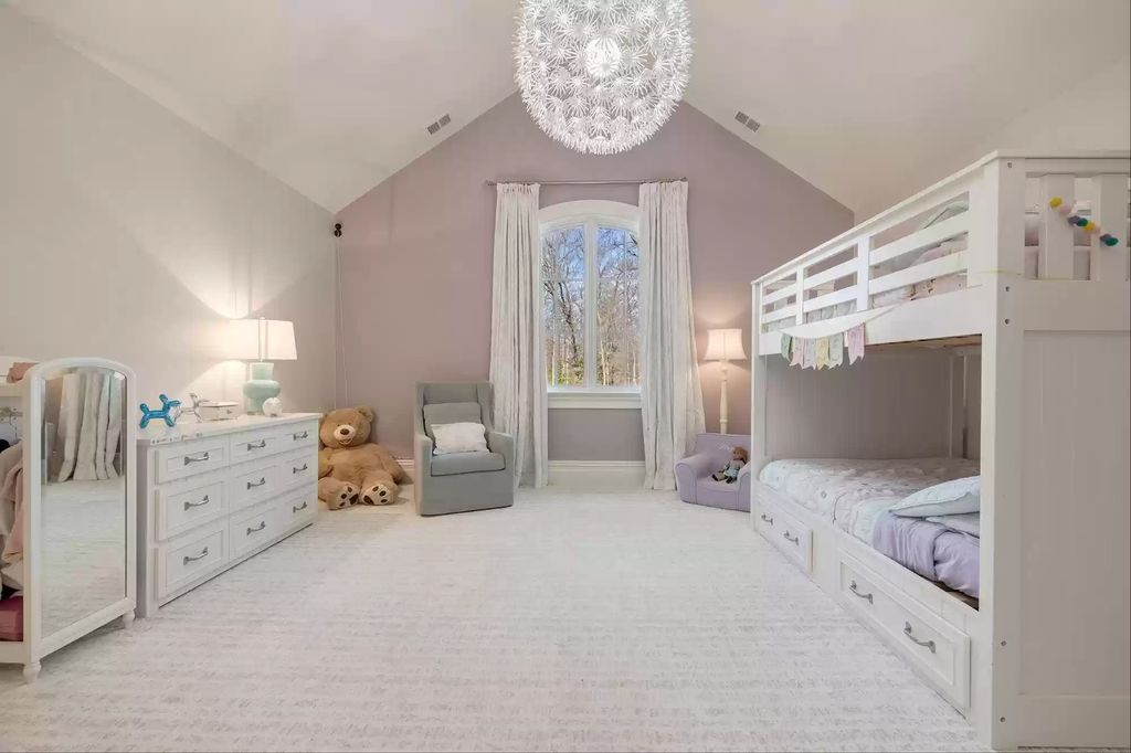 For your little princesses, this playful, girly room from House of Eilers is ideal. The low-profile wood construction is straightforward and a wonderful addition to a white bedroom.