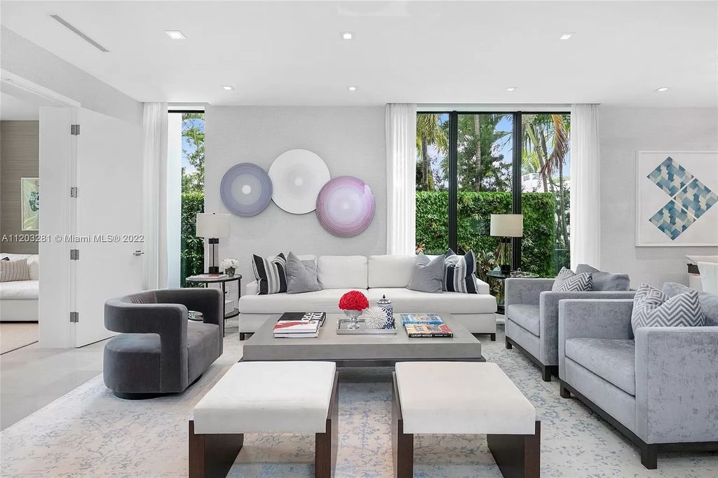 The Home in Miami Beach is a contemporary masterpiece nestled behind private gates on quiet Upper North Bay perfect for both family enjoyment now available for sale. This home located at 5327 N Bay Rd, Miami Beach, Florida