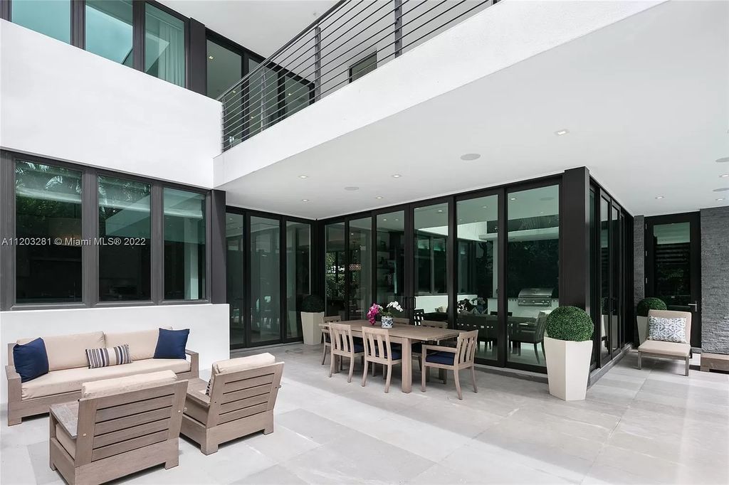 The Home in Miami Beach is a contemporary masterpiece nestled behind private gates on quiet Upper North Bay perfect for both family enjoyment now available for sale. This home located at 5327 N Bay Rd, Miami Beach, Florida