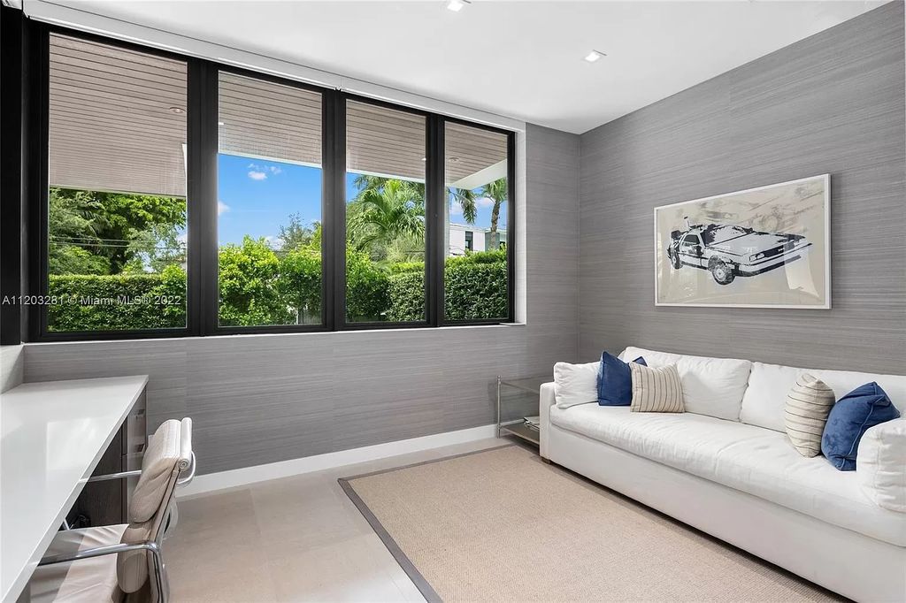 The Home in Miami Beach is a contemporary masterpiece nestled behind private gates on quiet Upper North Bay perfect for both family enjoyment now available for sale. This home located at 5327 N Bay Rd, Miami Beach, Florida