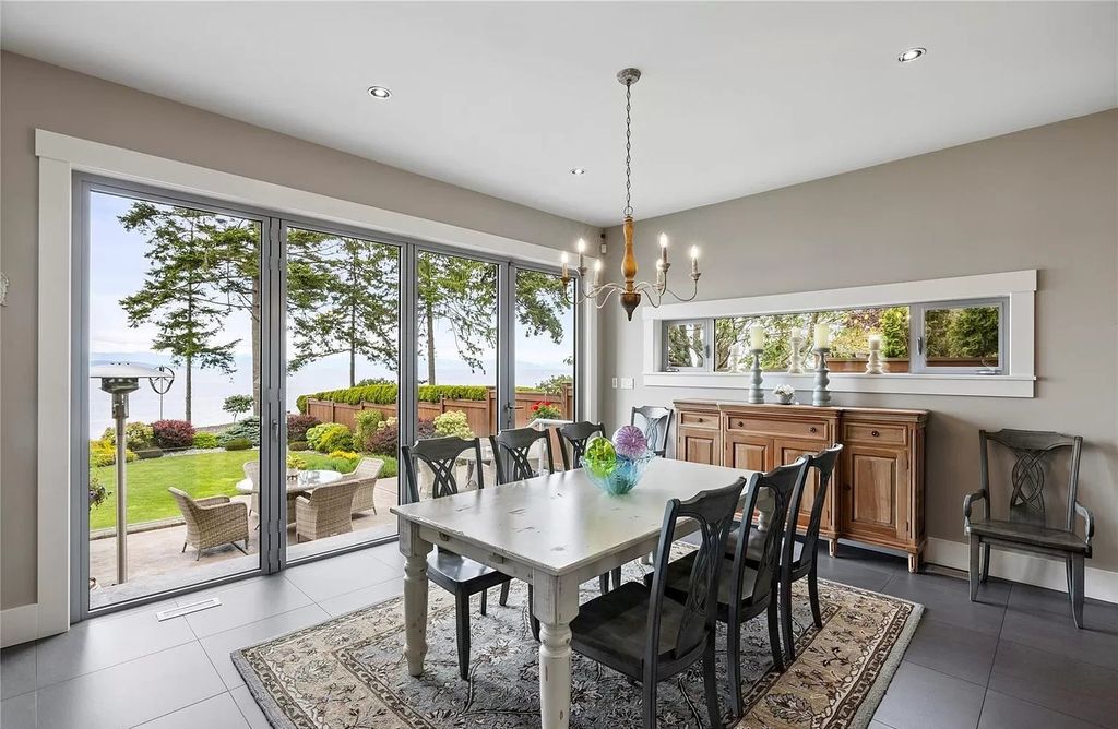 The Home in Parksville is majestically set on 0.64 of an acre with a private path that leads to the beach living space below, now available for sale. This home located at 798 Fairwind Ave, Parksville, BC V9P 1B2, Canada