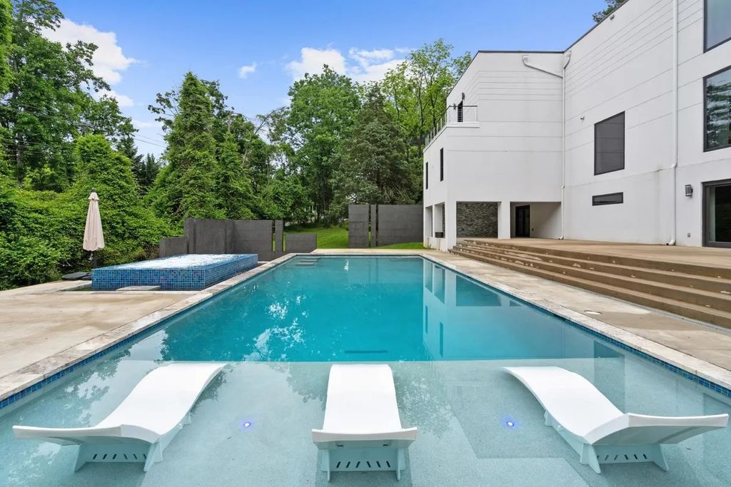 The Residence in Virginia is a modern masterpiece with the flexibility to both entertain and to live comfortably, now available for sale. This home located at 9100 Mill Pond Valley Dr, Mc Lean, Virginia