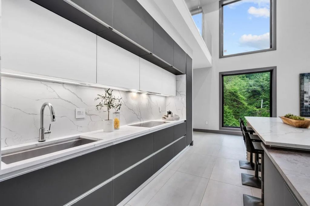 The Residence in Virginia is a modern masterpiece with the flexibility to both entertain and to live comfortably, now available for sale. This home located at 9100 Mill Pond Valley Dr, Mc Lean, Virginia