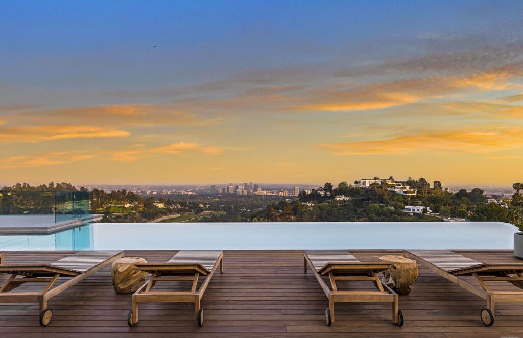 The Los Angeles Mansion is an architectural triumph that redefines luxury living in the world's most prestigious location with the best views in LA now available for sale. This home located at 10721 Stradella Ct, Los Angeles, California