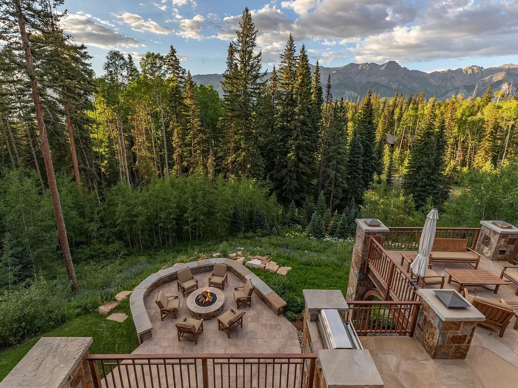 The Home in Mountain Village, a stunning retreat has a gorgeous outdoor living with main level expansive deck fit for large party entertaining, amazing views from all rooms. This home located at 522 Benchmark Dr, Mountain Village, Colorado.