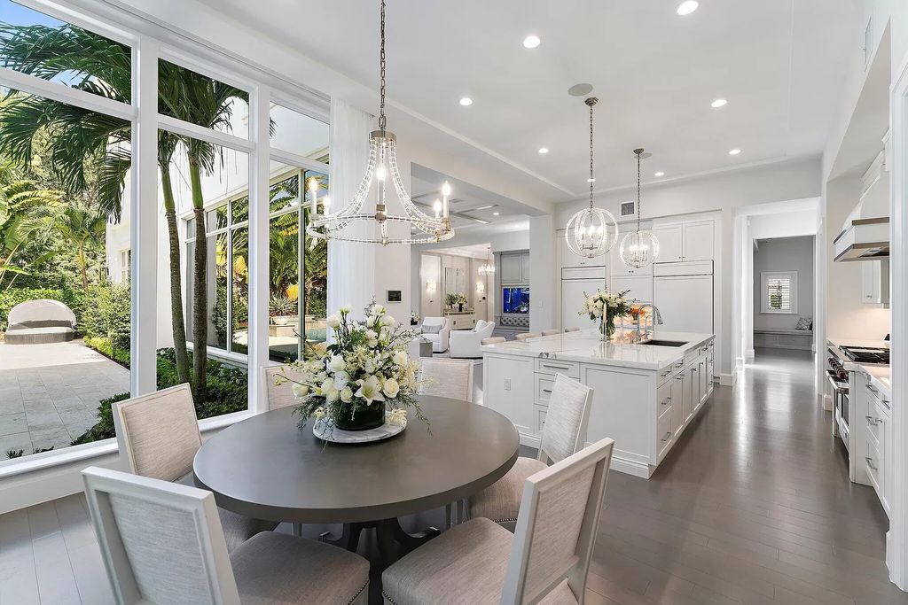 The Home in Palm Beach Gardens, a masterfully designed refuge with open format living area and resort style backyard including pool, covered lanai and outdoor kitchen. This home located at 11757 Elina Ct, Palm Beach Gardens, Florida.