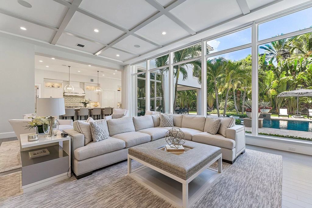 The Home in Palm Beach Gardens, a masterfully designed refuge with open format living area and resort style backyard including pool, covered lanai and outdoor kitchen. This home located at 11757 Elina Ct, Palm Beach Gardens, Florida.