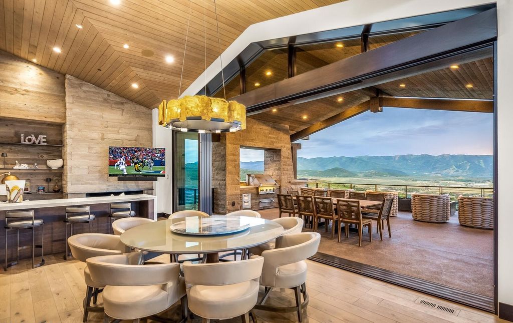 The Masterpiece in Park City, an amazing Upwall Design home showcases the stunning views, the majestic expanse of the main hallway, the seamless marriage of wood, stone and glass. This home located at 7400 Bugle Trl, Park City, Utah.