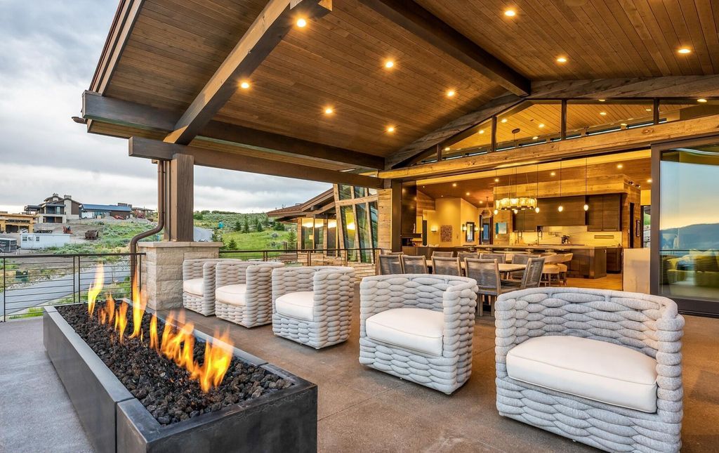 The Masterpiece in Park City, an amazing Upwall Design home showcases the stunning views, the majestic expanse of the main hallway, the seamless marriage of wood, stone and glass. This home located at 7400 Bugle Trl, Park City, Utah.
