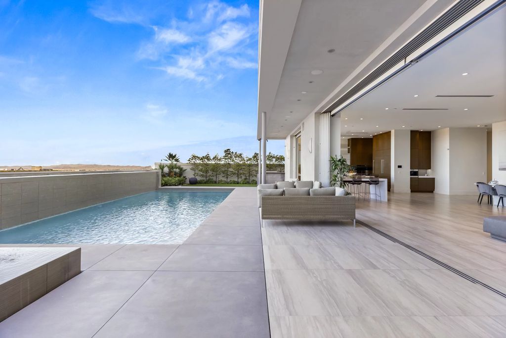 The Masterpiece in Las Vegas, a stunning contemporary home majestically perched within the prestigious guard-gated Spanish Hills offering some of the best Las Vegas Strip views. This home located at 5198 Scenic Ridge Dr, Las Vegas, Nevada.
