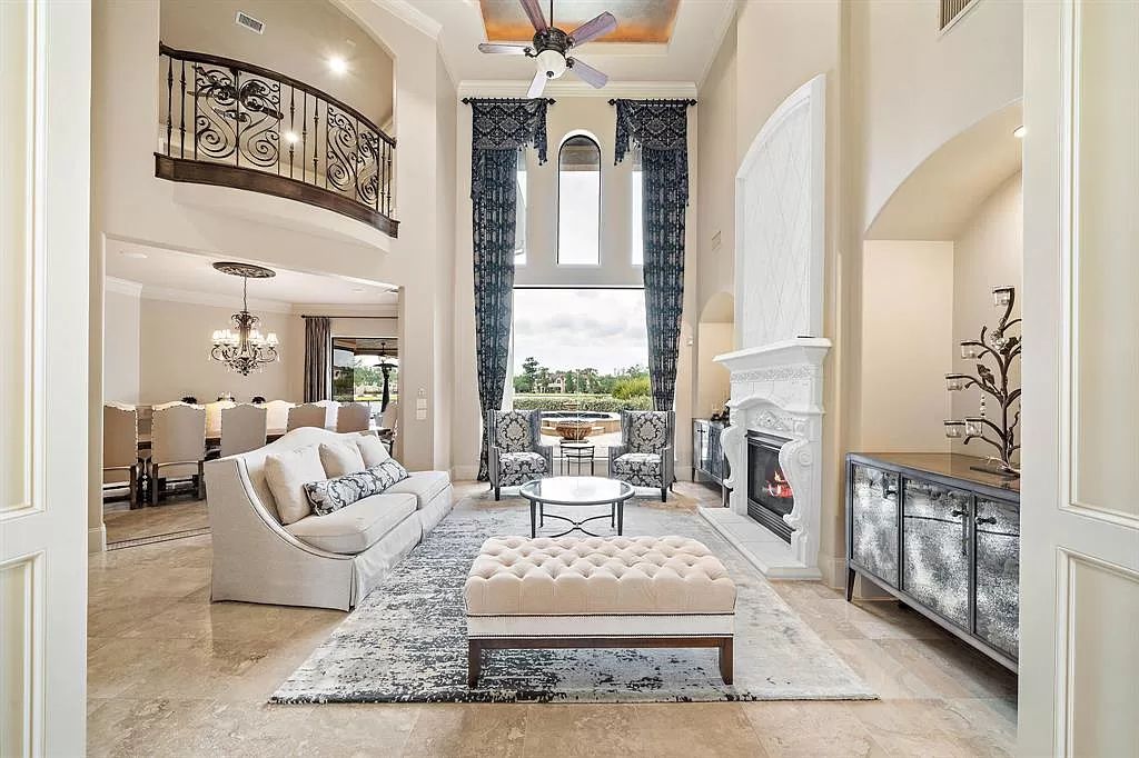 The Estate in Richmond, a private oasis nestled within The Retreat at Sovereign Shores offers resort style with a lavish swimming pool, tennis court, multiple outdoor patios is now available for sale. This home located at 12 Retreat Blvd, Richmond, Texas 
