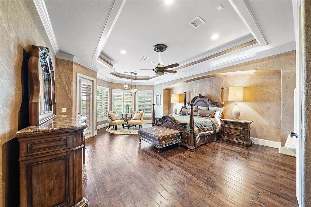 The Estate in Richmond, a private oasis nestled within The Retreat at Sovereign Shores offers resort style with a lavish swimming pool, tennis court, multiple outdoor patios is now available for sale. This home located at 12 Retreat Blvd, Richmond, Texas 
