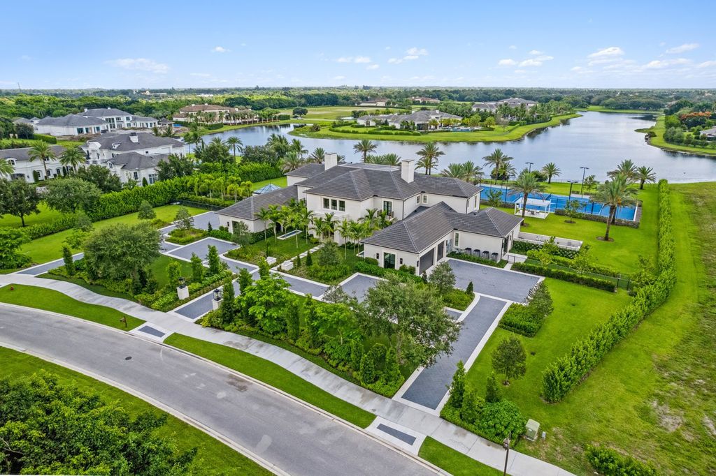 The Estate in Delray Beach, an extraordinary prestigious fully furnished custom home set prime lakefront site, open and mesmerizing T-shaped views. This home located at 16071 Quiet Vista Cir, Delray Beach, Florida.