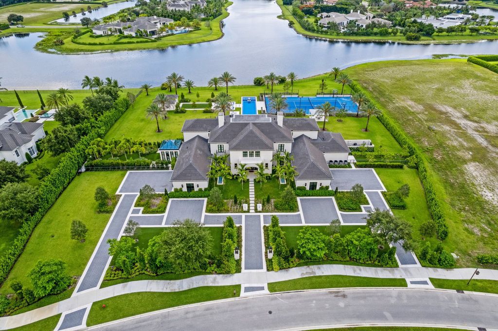 The Estate in Delray Beach, an extraordinary prestigious fully furnished custom home set prime lakefront site, open and mesmerizing T-shaped views. This home located at 16071 Quiet Vista Cir, Delray Beach, Florida.