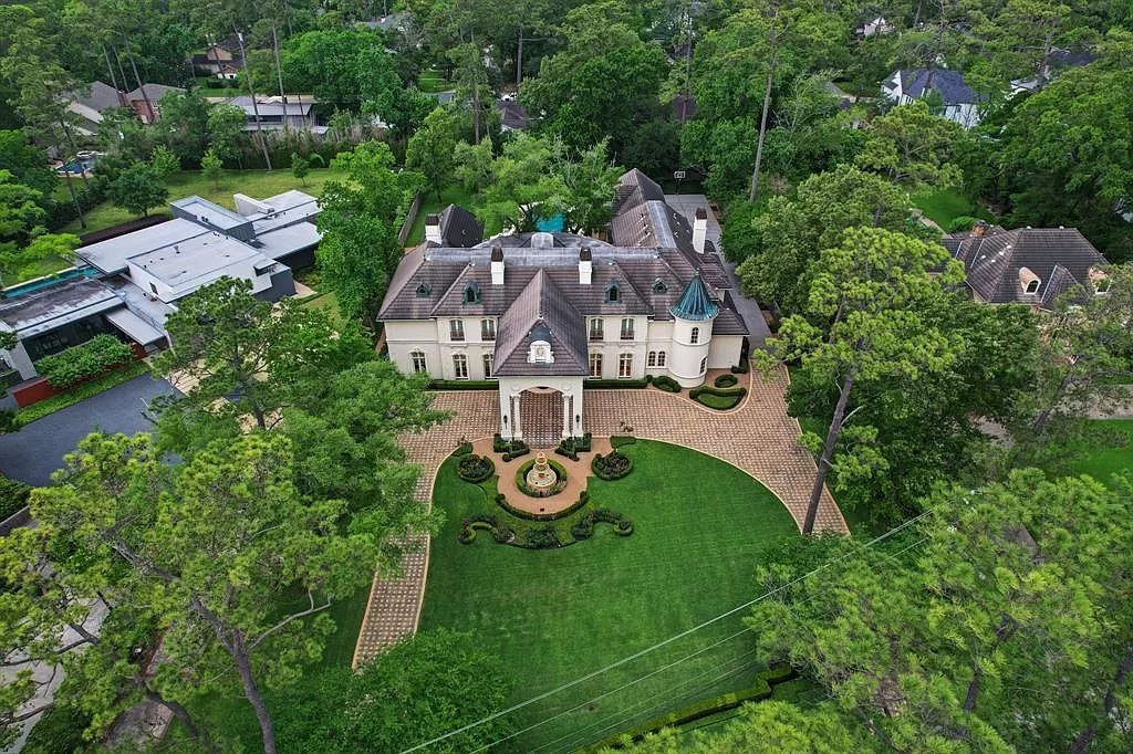 The Masterpiece in Houston, a memorial estate showcases cohesive French design elements blending rustic textures and bold materials. This home located at 705 Kuhlman Rd, Houston, Texas.