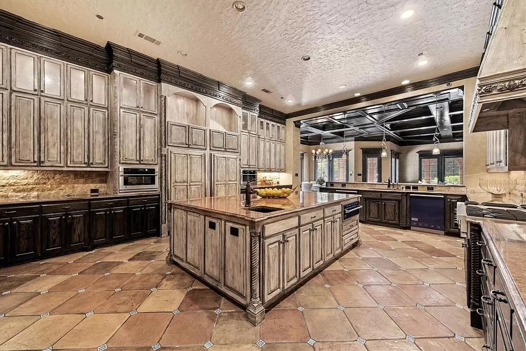 The Estate in Southlake, a castle-like residence blends old world appeal with a modern layout featuring breathtaking ceiling treatments and hand-carved moldings is now available for sale. This home located at 3716 N White Chapel Blvd, Southlake, Texas