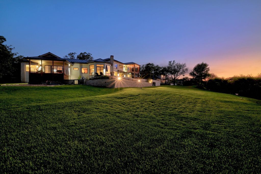 The Home in Austin, an impressive residence with thoughtful architectural detail, the finest modern fixtures, finishes throughout and sweeping hill country views. This home located at 7 Coleridge Ln, Austin, Texas.