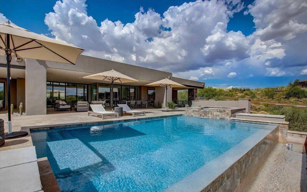 The Scottsdale Home, a brand new Mortensen Signature residence boasts natural elegance and contemporary desert flair. This home located at 10929 E Fortuna Dr, Scottsdale, Arizona