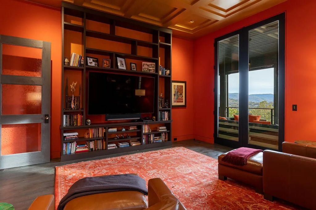 If you love orange tones thanks to the modernity that it brings, tangerine red is for you. Red tone is also one of the tones that are quite suitable for spaces with a large area and provided with enough light. As in the Warm Colors Living Room Ideas above, red tones are used for both the paint color and the carpet to create a synchronized whole.