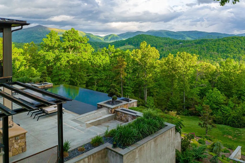 The Manor in Fairview is a modern sanctuary for those seeking the luxury, private mountain lifestyle, now available for sale. This home located at 5 Wild Wind Trl, Fairview, North Carolina