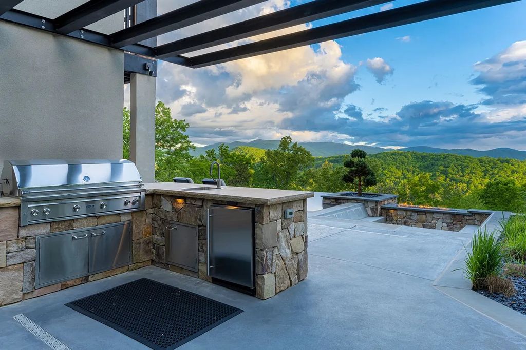 The Manor in Fairview is a modern sanctuary for those seeking the luxury, private mountain lifestyle, now available for sale. This home located at 5 Wild Wind Trl, Fairview, North Carolina