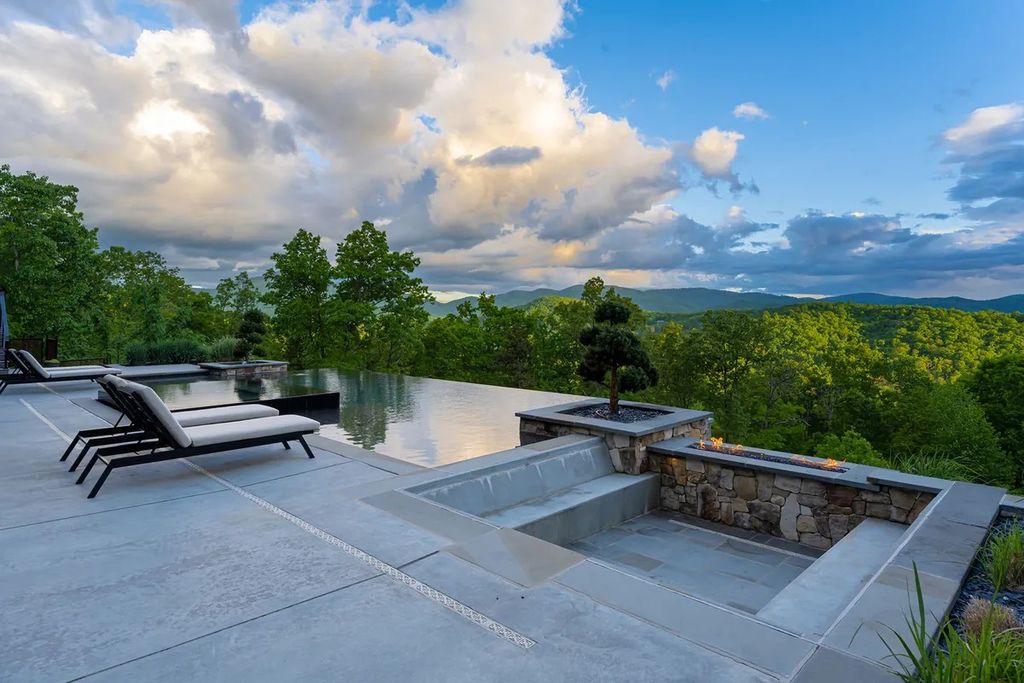 The Manor in Fairview is a modern sanctuary for those seeking the luxury, private mountain lifestyle, now available for sale. This home located at 5 Wild Wind Trl, Fairview, North Carolina