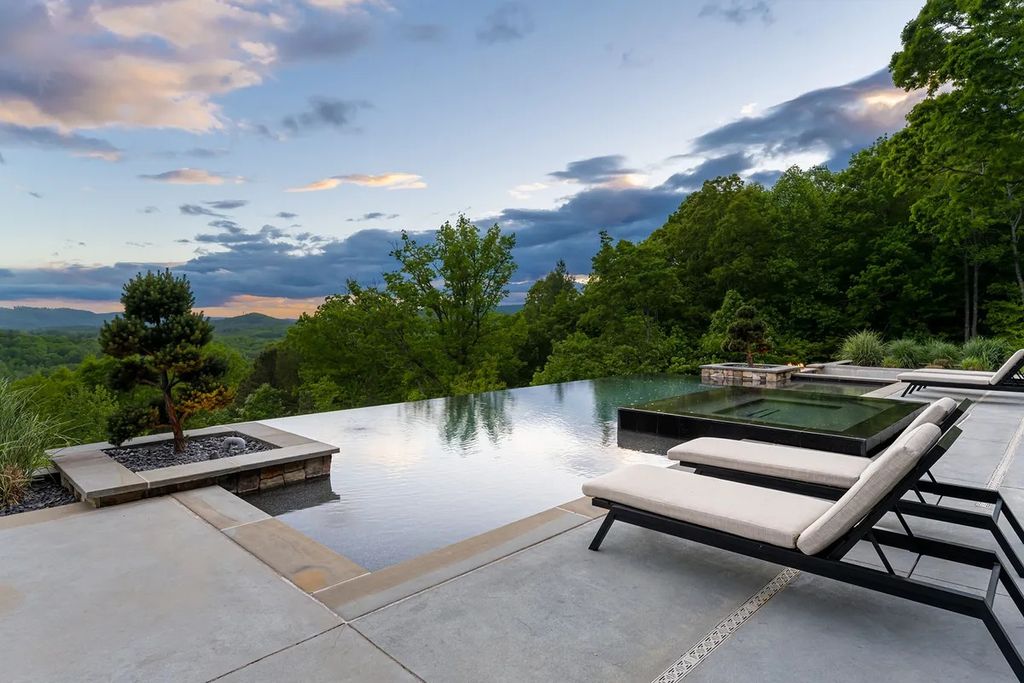 The Manor in Fairview is a modern sanctuary for those seeking the luxury, private mountain lifestyle, now available for sale. This home located at 5 Wild Wind Trl, Fairview, North Carolina