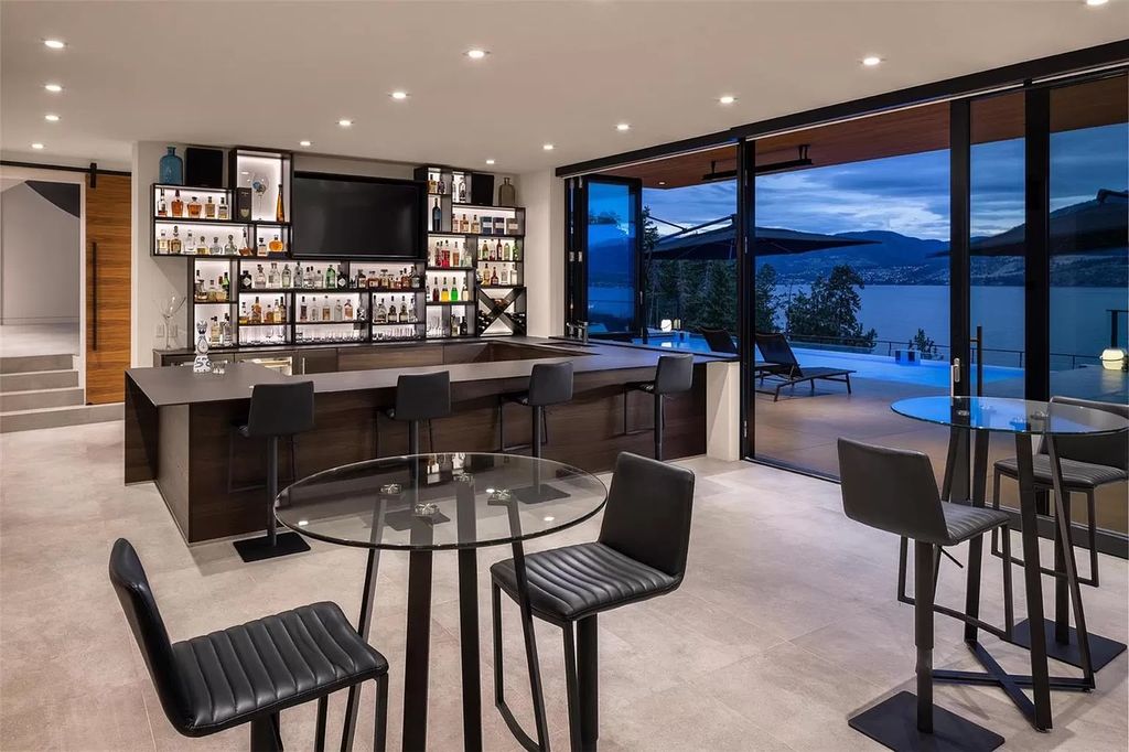 The Home in Kelowna offers unparalleled amenities, including stunning Japanese-inspired hidden garden, beach house, pool, and so much more, now available for sale. This home located at 6950 Lakeshore Rd, Kelowna, BC V1W 4J5, Canada