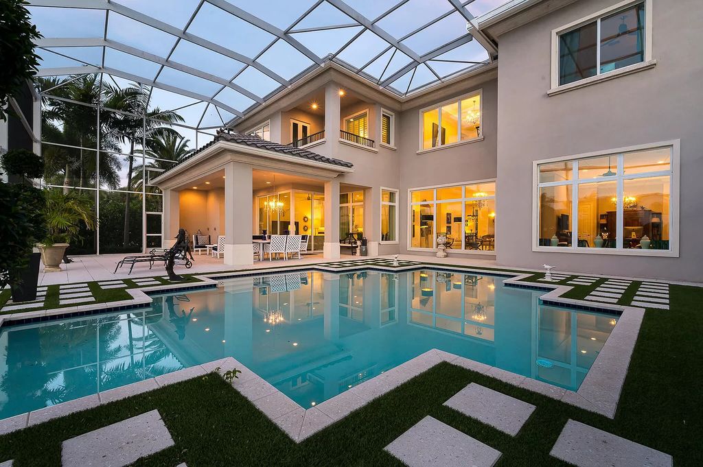 The Boca Raton Home, a smart residence is located on a premium lot overlooking the grand lake and features a breathtaking backyard is now available for sale. This home located at 9099 Redonda Dr, Boca Raton, Florida