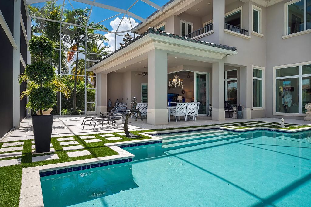 The Boca Raton Home, a smart residence is located on a premium lot overlooking the grand lake and features a breathtaking backyard is now available for sale. This home located at 9099 Redonda Dr, Boca Raton, Florida