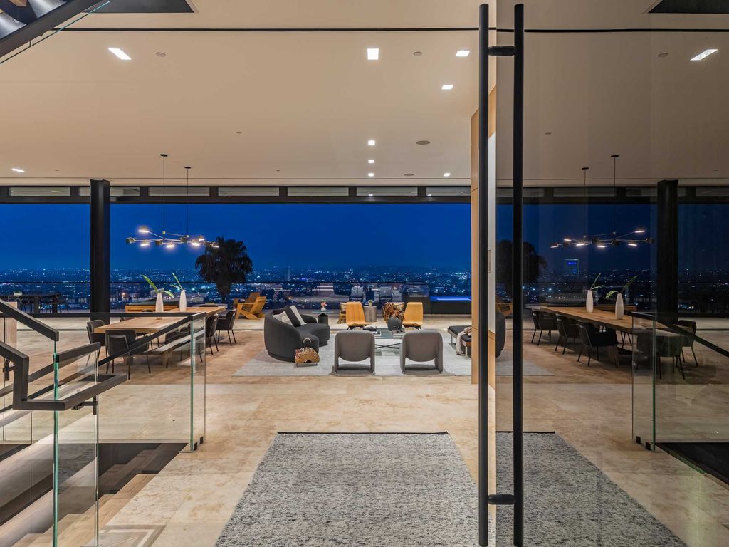 The Mansion in Los Angeles, a new modern retreat in absolute splendor with panoramic breathtaking views from Downtown LA to Century City is now available for sale. This home located at 8365 Sunset View Dr, Los Angeles, California
