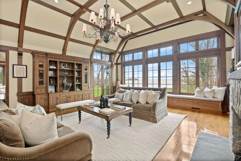 The Manor in Riverside features water views throughout the high ceilinged rooms showcasing tasteful finishes and millwork, now available for sale. This home located at 88 Cedar Cliff Rd, Riverside, Connecticut