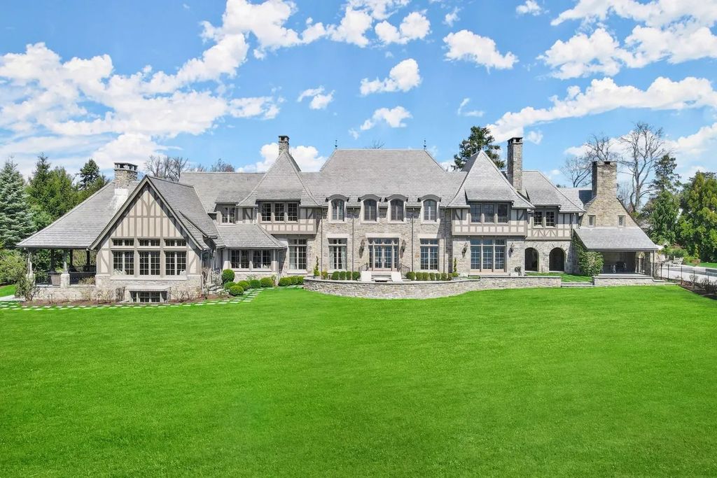 The Manor in Riverside features water views throughout the high ceilinged rooms showcasing tasteful finishes and millwork, now available for sale. This home located at 88 Cedar Cliff Rd, Riverside, Connecticut
