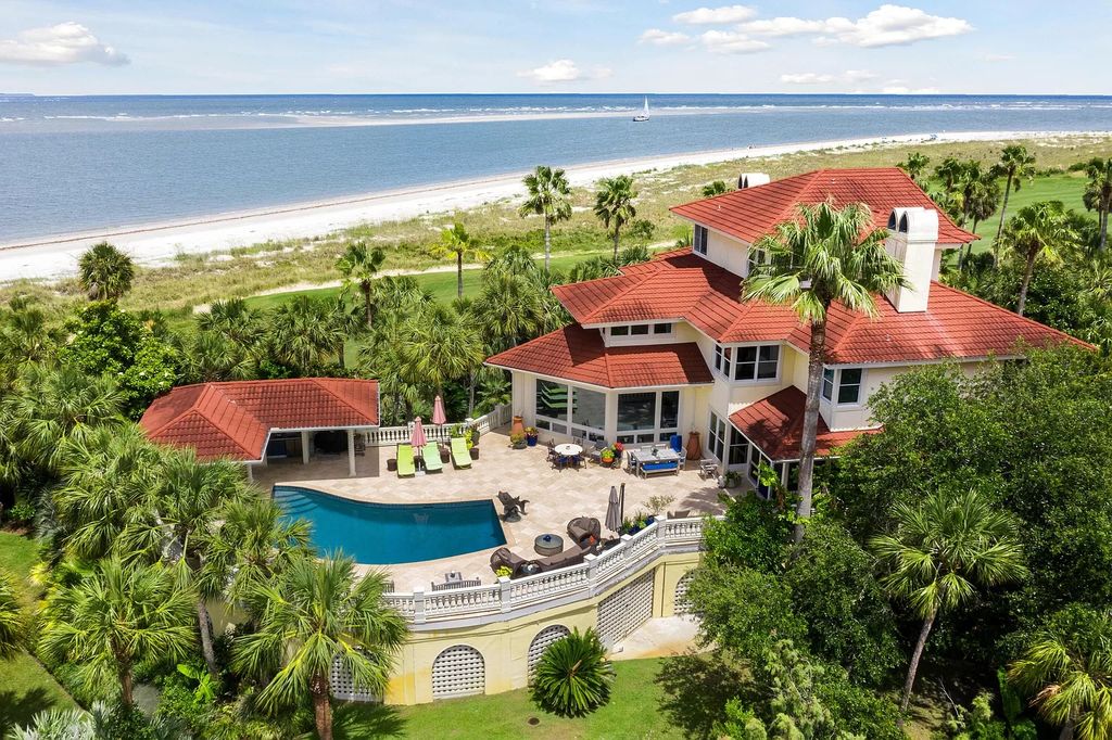 The Retreat in Isle Of Palms offers a spacious interior, inviting outdoor living spaces and mature landscaping, now available for sale. This home located at 61 Ocean Poin, Isle Of Palms, South Carolina