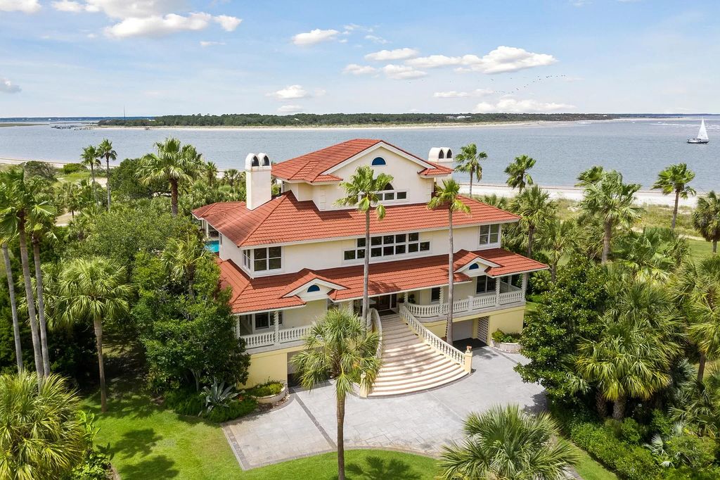 The Retreat in Isle Of Palms offers a spacious interior, inviting outdoor living spaces and mature landscaping, now available for sale. This home located at 61 Ocean Poin, Isle Of Palms, South Carolina