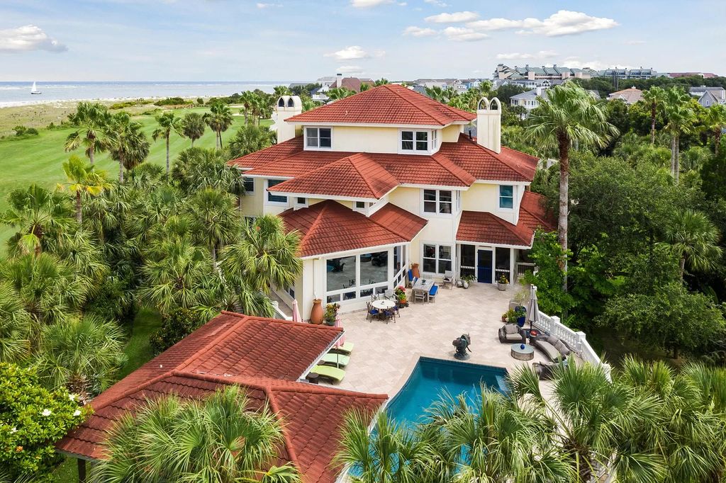 The Retreat in Isle Of Palms offers a spacious interior, inviting outdoor living spaces and mature landscaping, now available for sale. This home located at 61 Ocean Poin, Isle Of Palms, South Carolina